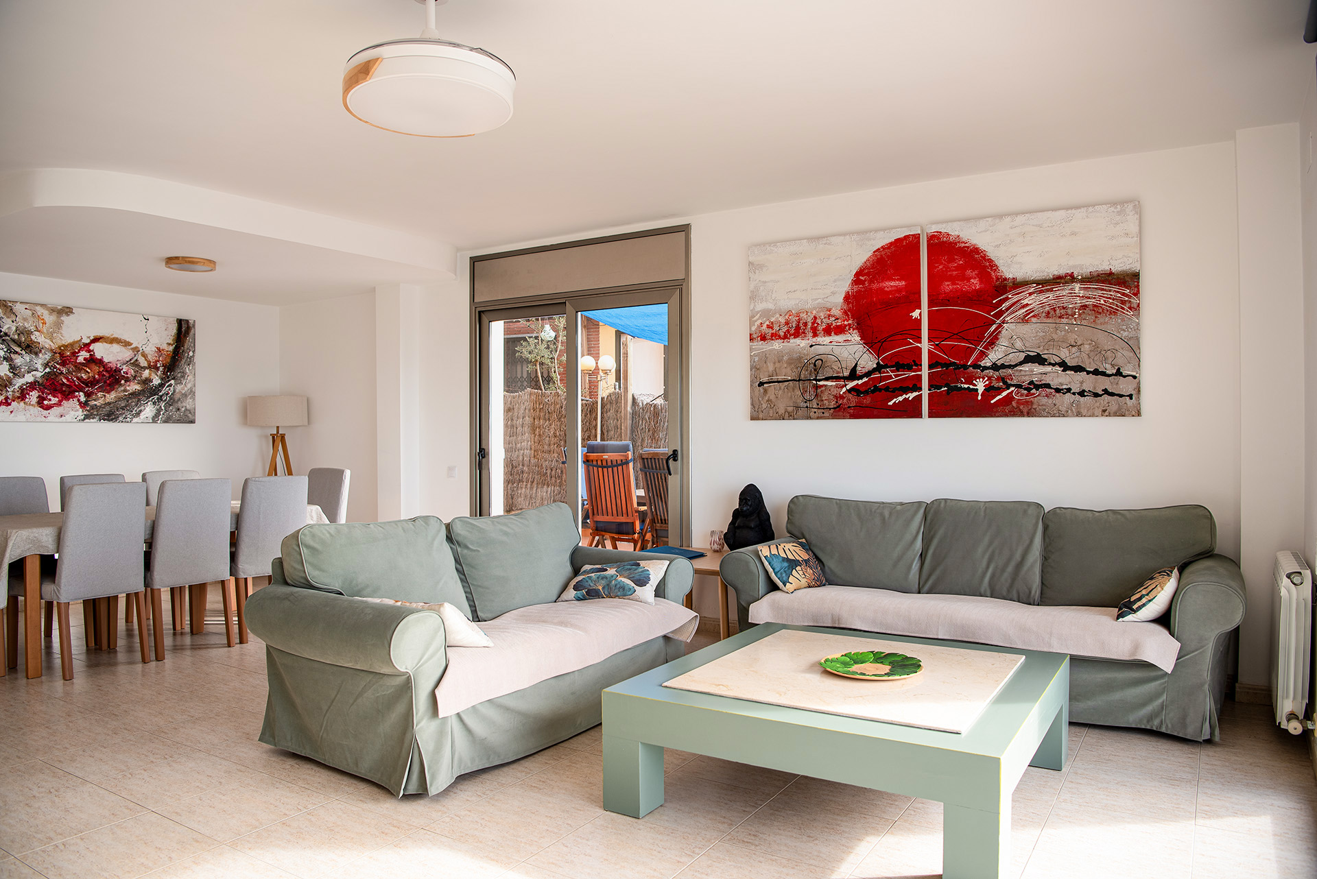 Open-plan living and dining area with terrace access — Villa MiraMar near Girona